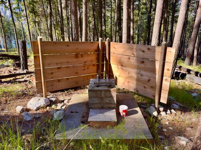Pit toilet near Meadow Creek Shelter with privacy screens