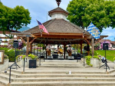 Gazebo bandstand with Bavarian flags at Front Street Park in downtown Leavenworth