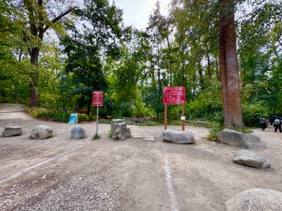 Red park-rule signs at the Waterfront Park entrance