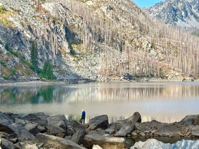 Angler fishing Eightmile Lake in the Alpine Lakes Wilderness near Leavenworth, Washington