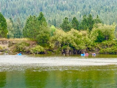 People river tubing the Wenatchee River near Leavenworth, Washington