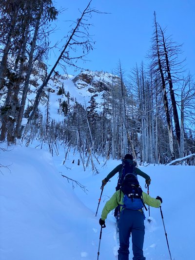 Skinning up with the chute from our first run in the background