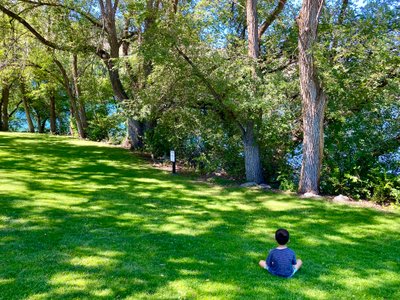 My son enjoying the shade along the Chelan Riverwalk trail