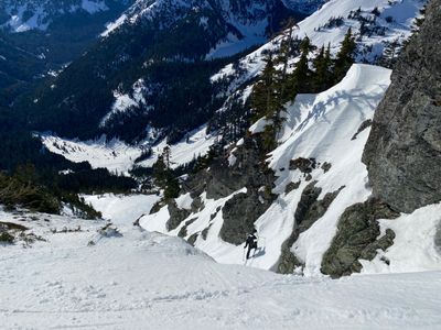 Lucas navigates a tight entrance to a small couloir on Chikamin Peak