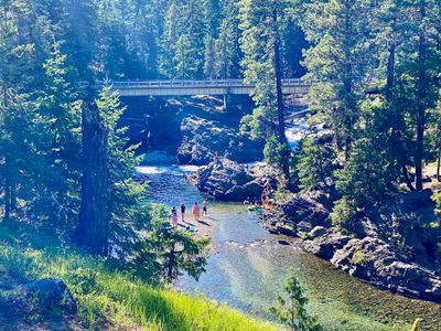 People enjoying the river near the campground